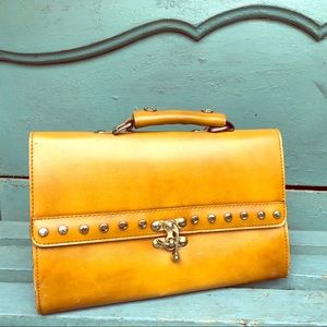 Vintage leather handbag with stud detail.